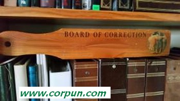 Wooden paddle inscribed 'Board of Correction'