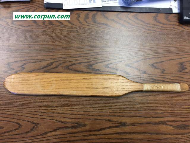 A wooden paddle