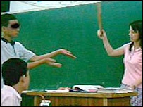 A pupil being caned by his teacher in Taiwan