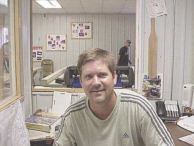 teacher Jon Tucker with paddle