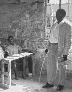teacher in classroom with cane