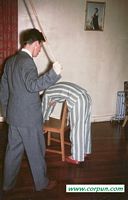 Prefect administering a caning: CLICK TO ENLARGE